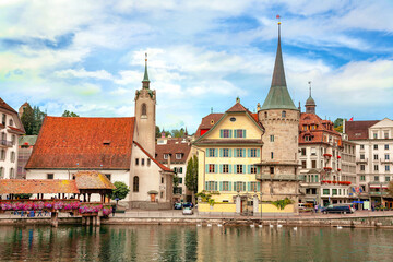 Wall Mural - View of historic buildings, chapel and footbridge on Reuss river in Lucerne, Switzerland