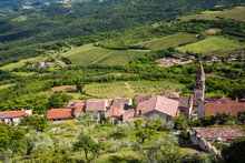 High Angle View Of Village With Fields In Background