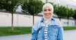© VAKSMANV - Portrait of young Arabian beautiful woman in traditional hijab smiling to camera cheerfully and standing at street. Muslim pretty happy girl with smile posing outdoor. Islamic female at walk.