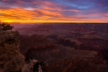 View Of Mountains In Grand Canyon National Park Against Cloudy Sky During Sunset