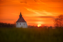 View Of Chapel Against Cloudy Sky During Sunset