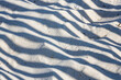 © Tandem Stock - High angle view of shadow pattern on sand in desert