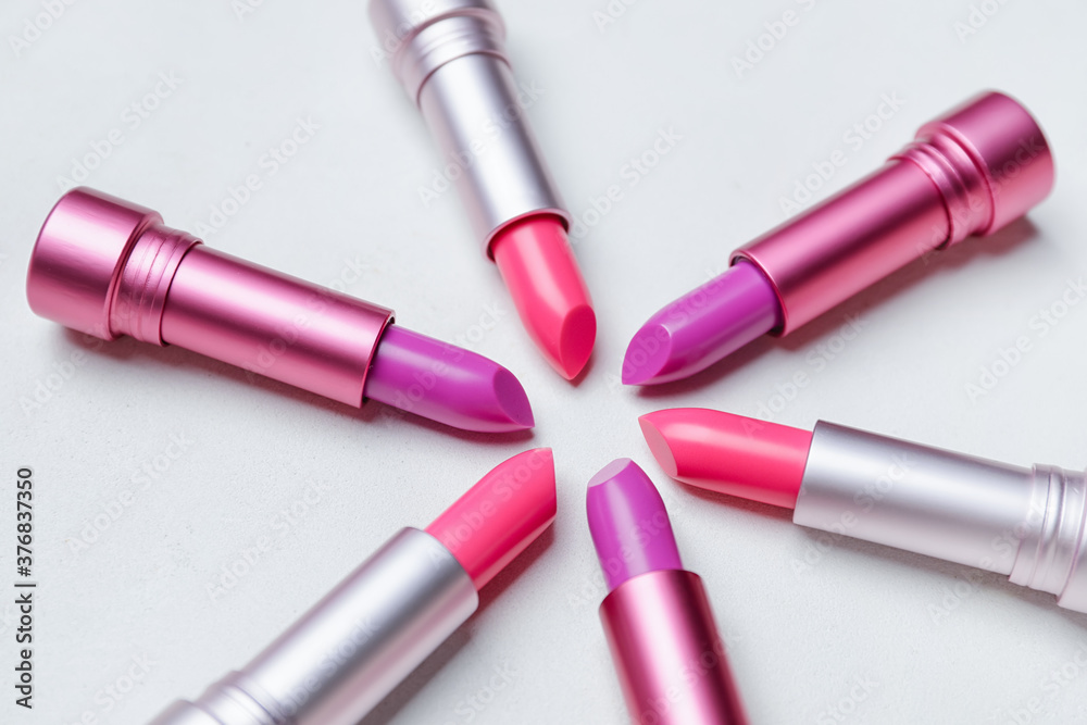 Different lipsticks on light background
