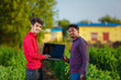 © PRASANNAPIX - young agronomist analyzing field with farmer, indian farming