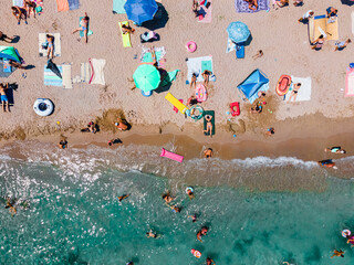 Wall Mural - Aerial Beach Photography, People And Colorful Umbrellas On Seaside Beach