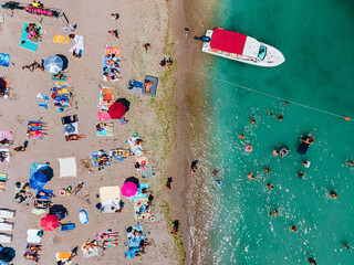 Wall Mural - Aerial Beach Drone Photography, People And Umbrellas On Sea Beach