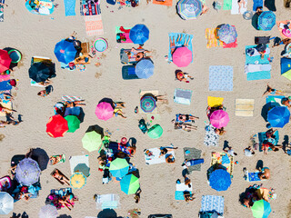 Wall Mural - Aerial View Of People And Colorful Umbrellas On Ocean Seaside Beach In Summer