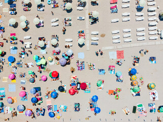 Wall Mural - Aerial View Of People And Colorful Umbrellas On Ocean Seaside Beach In Summer