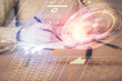 © peshkova - Double exposure of writing hand on background with data technology hologram. Big data concept.