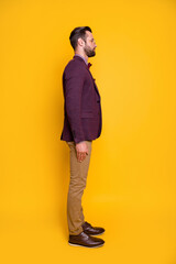 Sticker - Vertical profile side full length body size view of his he nice attractive content guy model wearing cool look posing isolated over bright vivid shine vibrant yellow color background