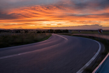 Wall Mural - winding asphalt road with added motion blur, good as a base for car rendering