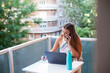 © CarlosGutierrez - Head shot young happy woman working from home