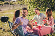 © deagreez - Portrait of four nice attractive confident cool cheerful cheery guys group best buddy fellow eating lunch spending weekend sunny day fresh air showing thumbup recommend rest relax chill vacation