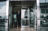Fototapeta  - Confident businessman leaving airport