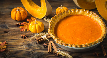 Pumpkin pie on the wooden table