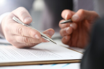 Wall Mural - Male arm in suit and tie fill form clipped pad with silver pen closeup. Sign gesture read pact sale agent bank job make note loan credit mortgage investment finance executive chief legal teamwork law