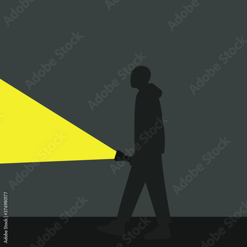 Cuadros en Lienzo Silhouette of a male character with a luminous flashlight in the dark