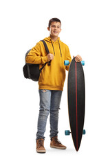 Wall Mural - Male teenage student in a yellow hoodie standing and holding a longboard