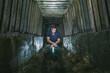 © Hennadii - The guy in the underground tunnel inside old sewer shaft