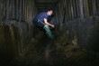 © Hennadii - The guy in the underground tunnel inside old sewer shaft