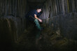 © Hennadii - The guy in the underground tunnel inside old sewer shaft