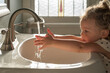 © Kristen - Cute little toddler girl washing her hands