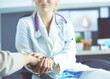 © lenets_tan - Doctor or nurse holding elderly lady's hands