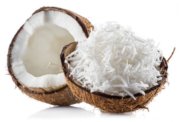 Wall Mural - Coconut fruit and shredded coconut flakes in the piece of shell isolated on white background.