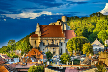 A view of the roofs of the houses and renaissance Parish Church of St. John the Baptist and St. Bartholomew, Kazimierz Dolny, Poland 