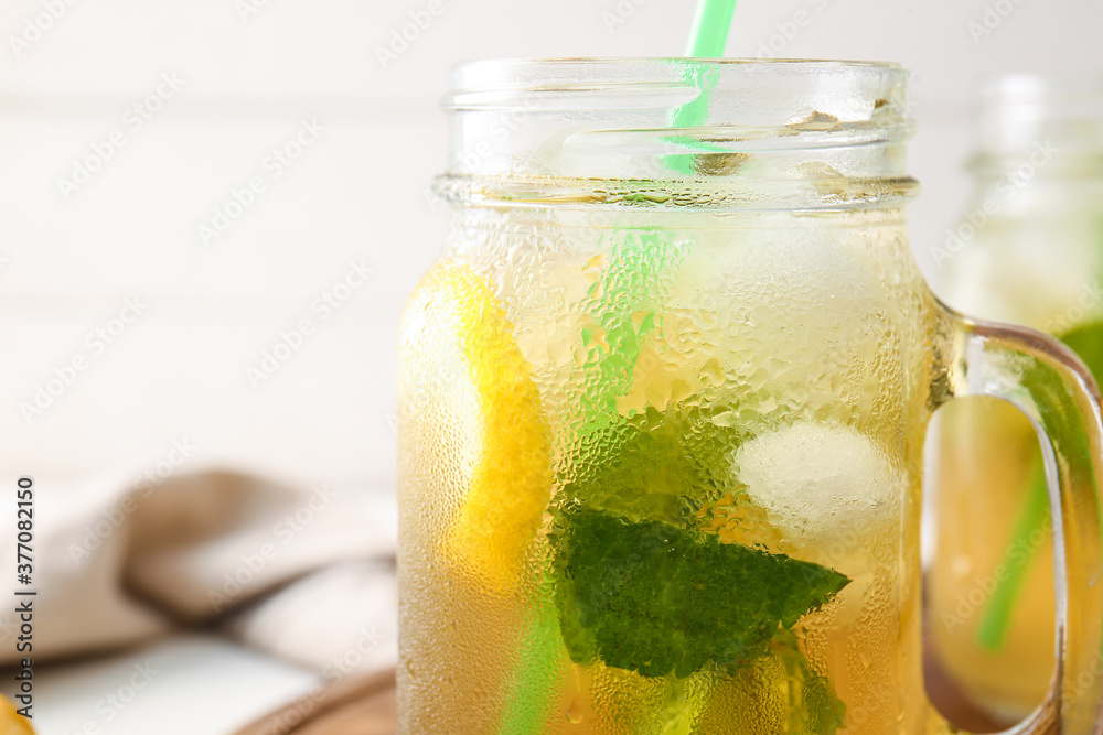 Mason jar of tasty cold ice tea, closeup