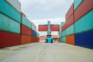 Forklift truck working lifting cargo industrial container box at shipping yard for transportation import,export and logistic industrial