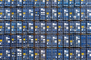 Wall Mural - Colorful stack pattern of cargo shipping containers in shipping yard for import,export industrial