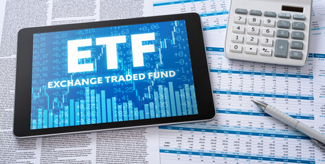 Wall Mural - a tablet with financial documents - etf