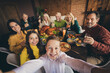 © deagreez - Self-portrait of nice attractive cheerful big full family small little kids parents grandparents meeting eating turkey harvest celebration at modern loft industrial brick interior house