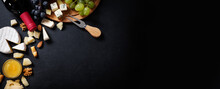 Menu Frame With Different Types Of Cheese, Honey, Grapes And Wine On Black Background