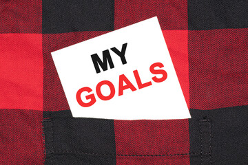 Poster - white business card with text my goals lies in the sleeve of a checkered shirt