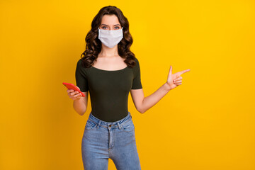 Sticker - Portrait of her she nice attractive healthy content wavy-haired girl wear safety mask showing copy space using device stop mers cov pandemia isolated bright vivid shine vibrant yellow color background