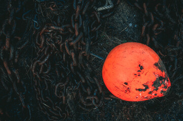 Red bouy with rusty chain