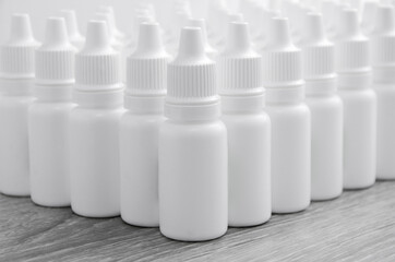 White bottles. Medical drops. Packaging for nal or ophthalmic drops. Production of drops.