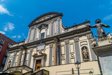 Wall Mural - View of Basilica di San Paolo Maggiore in the historic center of Naples, Italy with angel statue