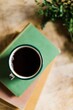 © Léa Jones/Stocksy - hot black tea with books