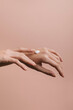 © Alberto Bogo/Stocksy - Woman Applying Cosmetic Creme On Her Hand
