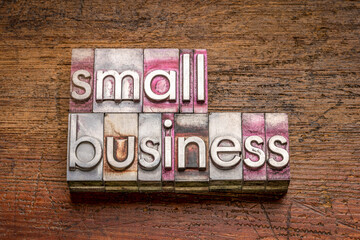 Wall Mural - small business word abstract in gritty vintage letterpress metal types against rustic weathered wood