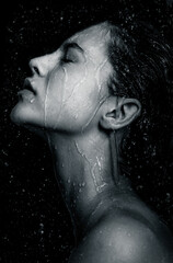 Wall Mural - Portrait young model  in water. Spa, skincare and wellness.  Shower, water, moisturizing concept.