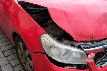 Aufkleber - red car with a broken hood. close-up
