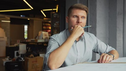 Poster - Thinking young man at work in the office