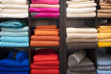Leinwandbilder - Row of colorful clothes on shelf
