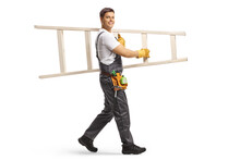 Full Length Shot Of A Repairman Walking And Carrying A White Ladder