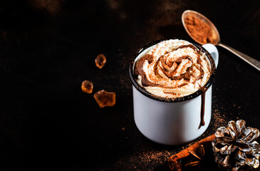 Wall Mural - Hot chocolate with whipped cream and cocoa powder in metal mugs. Winter and autumn time. Christmas warm drink. Copy space