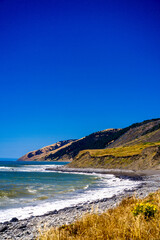 Wall Mural - Colorful Coast with ocean, waves, beach, mountains